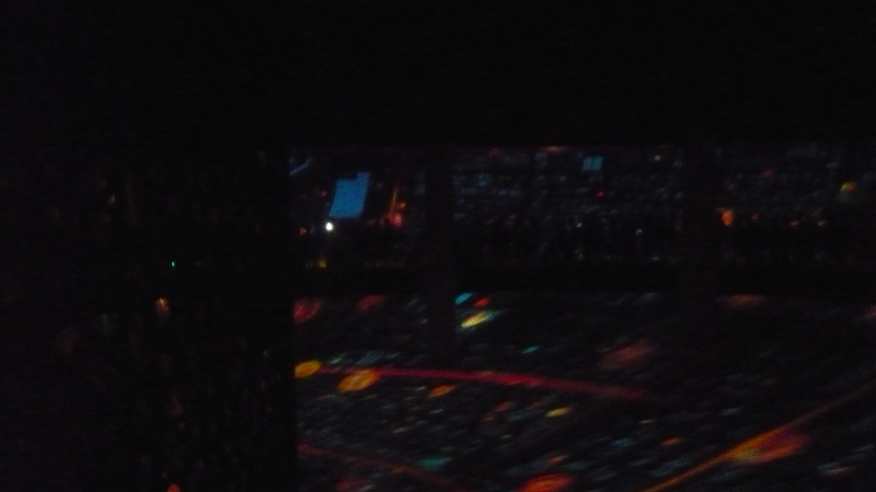 P1030153.JPG - You can see the silhouetted shapes of people on the moving sidewalk slowly circulating through the theater that surrounded us.