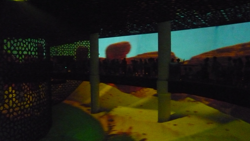 P1030157.JPG - And some sand dunes.  Or movies of them anyway.  This would be the first of many, many movies we would see at the Expo. (Or second actually, there was one earlier in the pavilion too.)