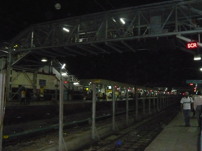 p1020108.jpg - You can see someone climbing up off the tracks, which they for some reason decided to cross.  I don't think we're in Japan anymore....