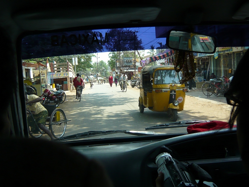 p1020115.jpg - A street in Eluru, with an auto-rickshaw coming toward us.