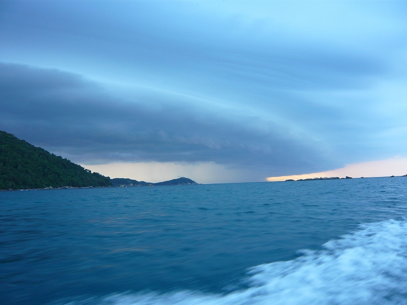 p1020466.jpg - Our ferry driver came and collected us a bit early after snorkeling because of the storm you can see rushing in here.
